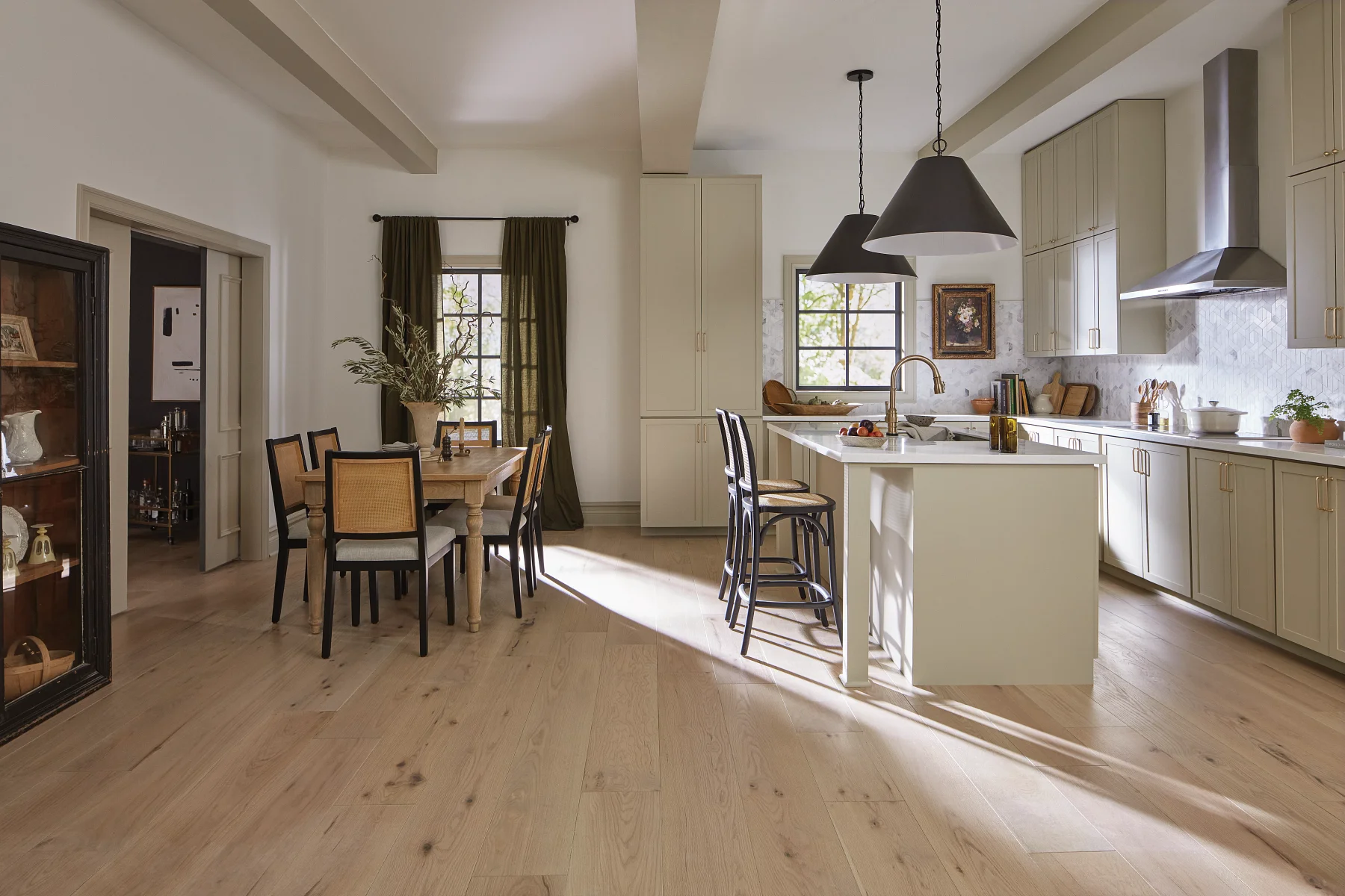 Shaw light oak hardwood across a sunlit kitchen and dining room